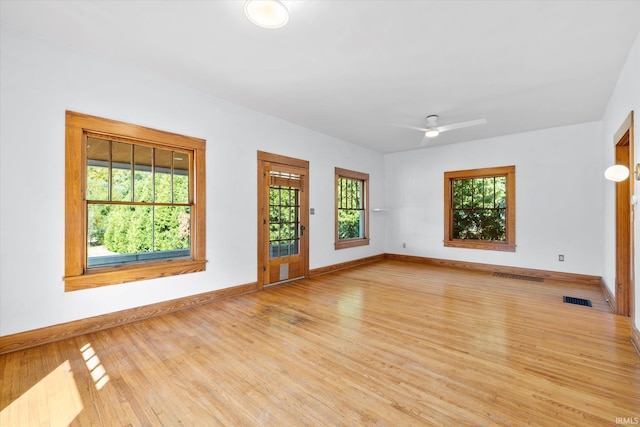 interior space with ceiling fan and light hardwood / wood-style flooring