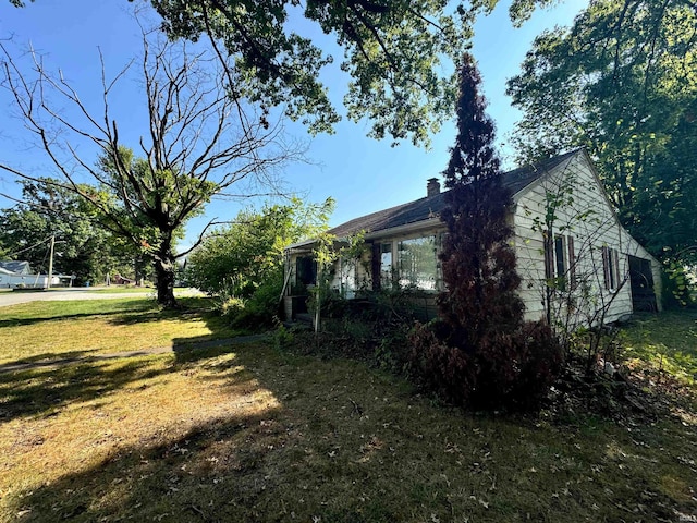 view of home's exterior featuring a lawn