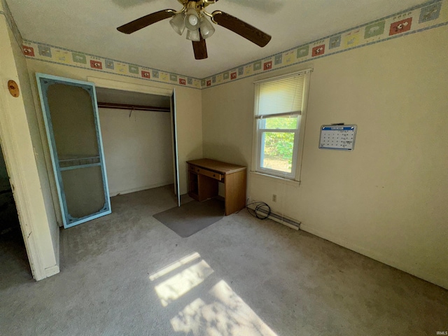 unfurnished bedroom featuring ceiling fan, light colored carpet, and a closet