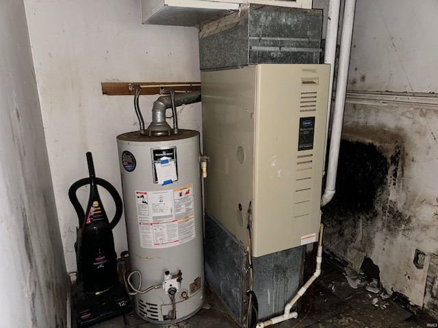 utility room featuring gas water heater