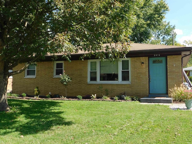 ranch-style home with a front yard