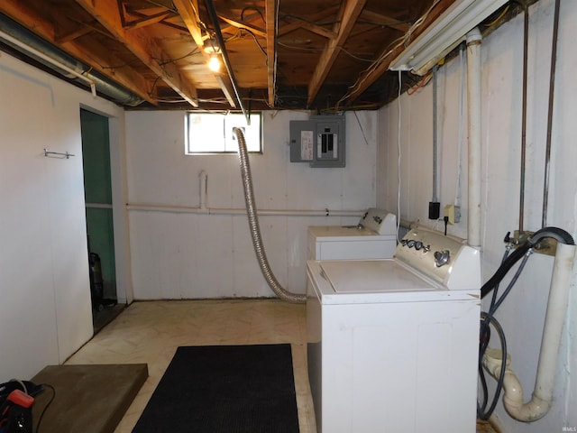 clothes washing area with electric panel and independent washer and dryer