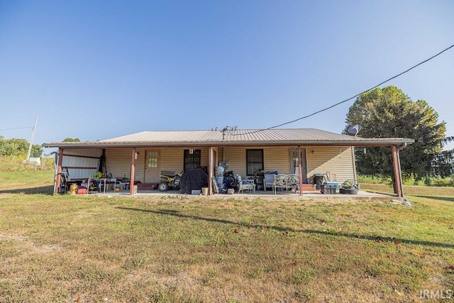 back of house with a yard