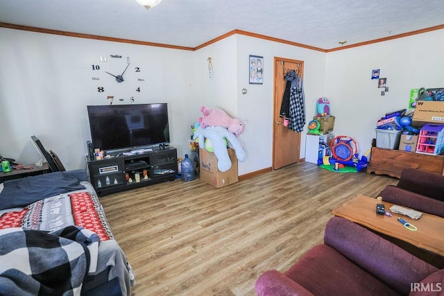 living room featuring hardwood / wood-style flooring and ornamental molding