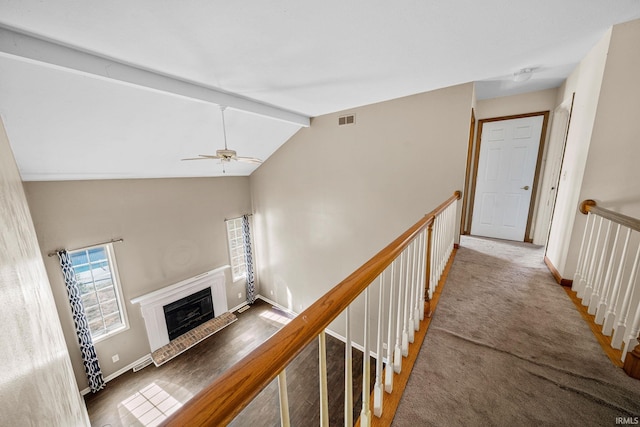 interior space with lofted ceiling with beams and hardwood / wood-style floors