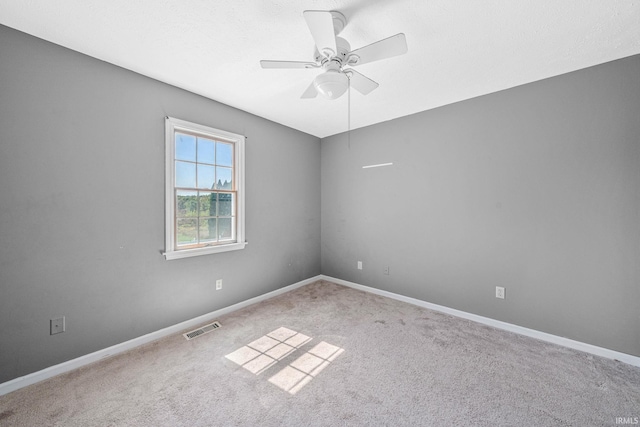 carpeted empty room with ceiling fan