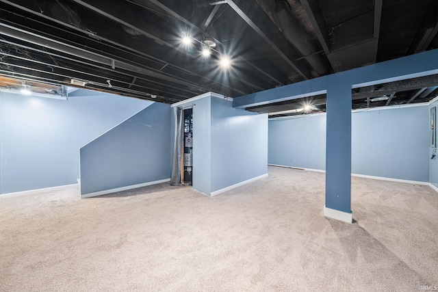 basement featuring carpet flooring