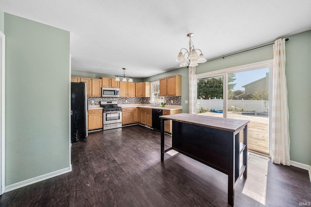 kitchen with backsplash, black appliances, decorative light fixtures, dark hardwood / wood-style floors, and a notable chandelier