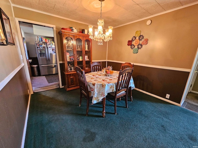 carpeted dining room with crown molding and a chandelier