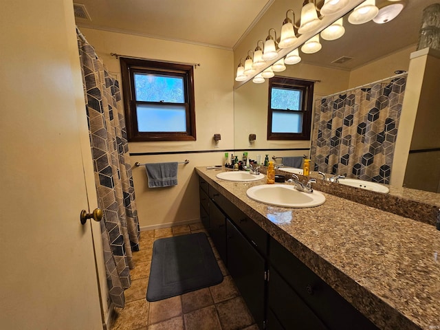 bathroom with vanity, plenty of natural light, ornamental molding, and curtained shower