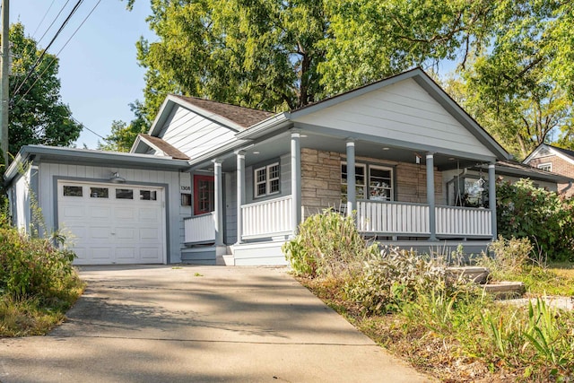 view of front of home with a garage and covered porch