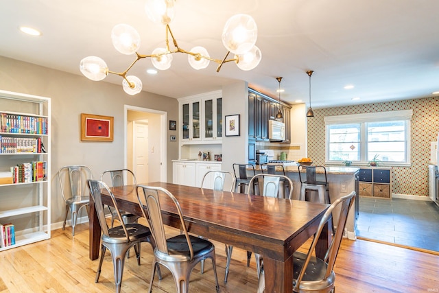 dining room featuring a chandelier and light hardwood / wood-style floors