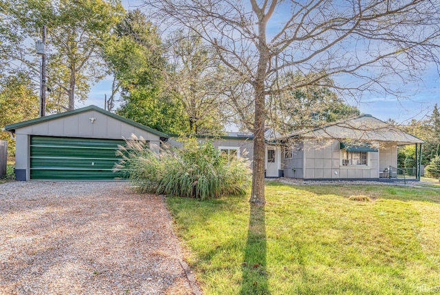 view of front facade with a front lawn and a garage