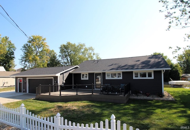 view of front of property featuring a front yard and a deck