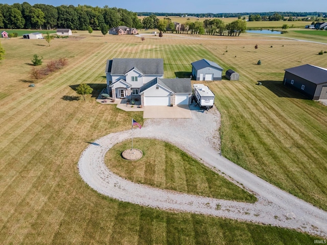 birds eye view of property with a rural view and a water view