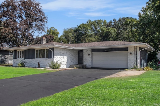 single story home with a garage and a front yard