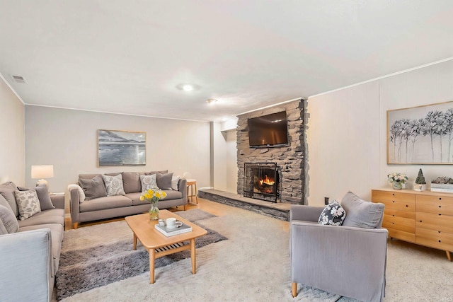 carpeted living room with a fireplace