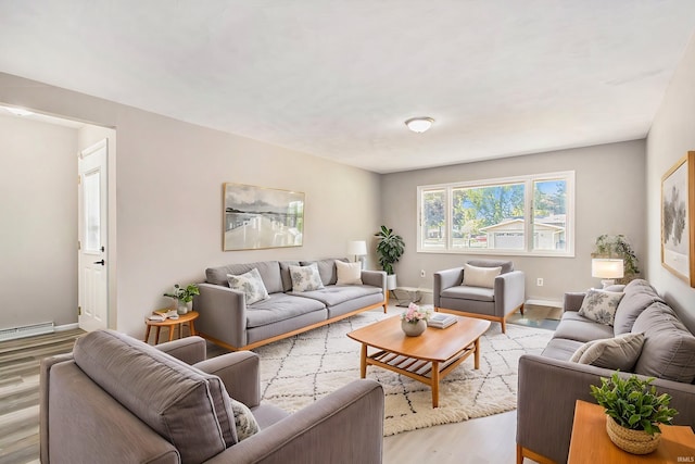 living room featuring light hardwood / wood-style floors and baseboard heating