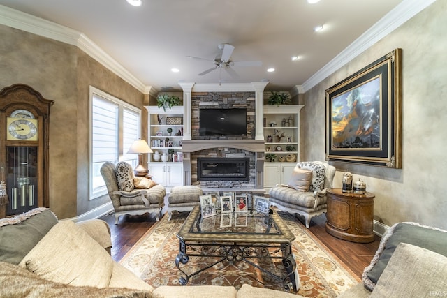 living room with crown molding, wood finished floors, and ceiling fan