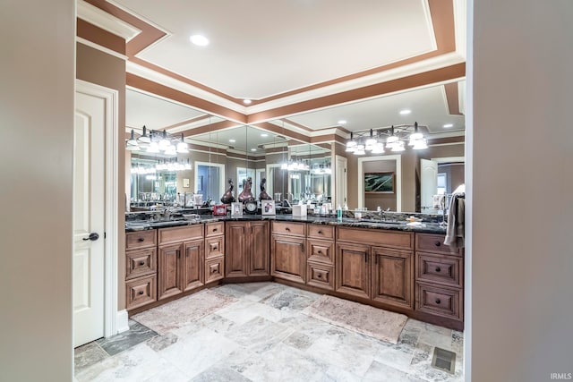 bathroom with vanity and ornamental molding