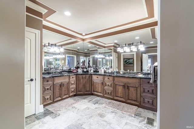 full bath with double vanity, ornamental molding, recessed lighting, and a sink