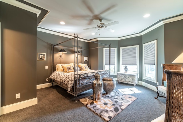 carpeted bedroom featuring ceiling fan and crown molding