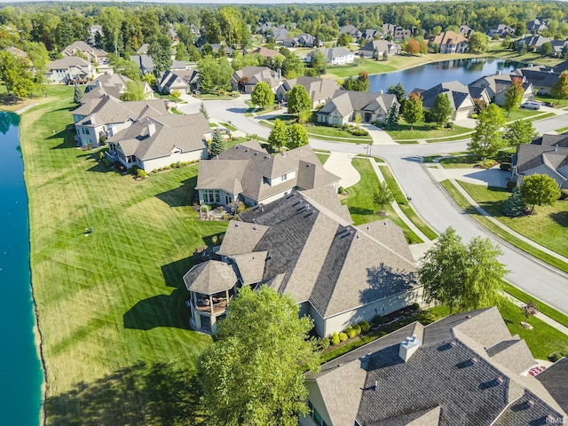 aerial view featuring a residential view and a water view