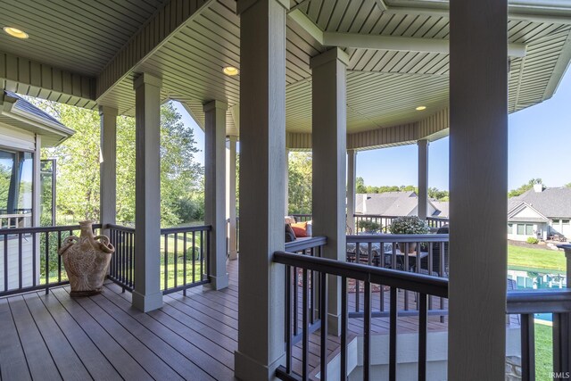 wooden terrace featuring covered porch