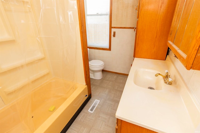 full bathroom with vanity, tile walls, toilet, and separate shower and tub