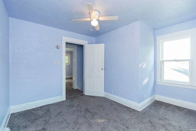 unfurnished room featuring carpet and ceiling fan