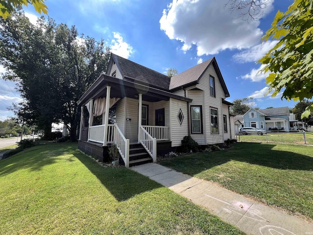 view of front of house featuring a porch and a front lawn