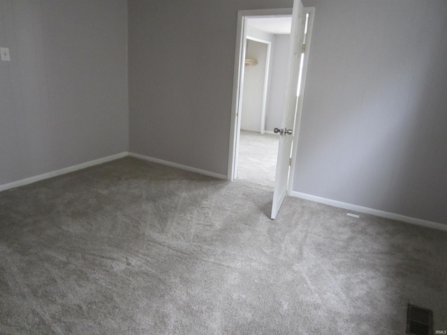 unfurnished room with carpet floors