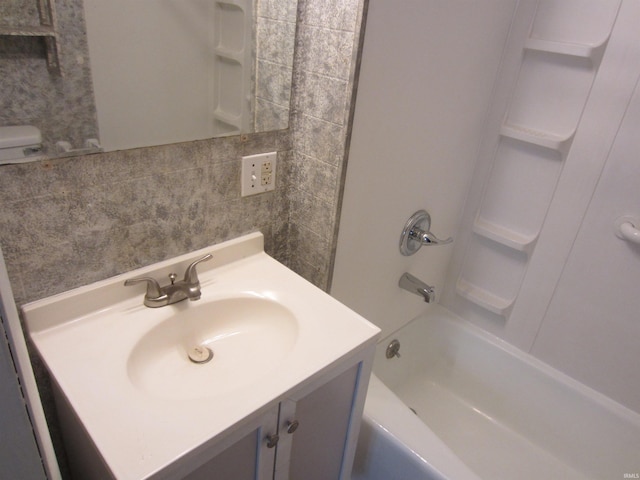 full bathroom featuring vanity, toilet, and bathtub / shower combination