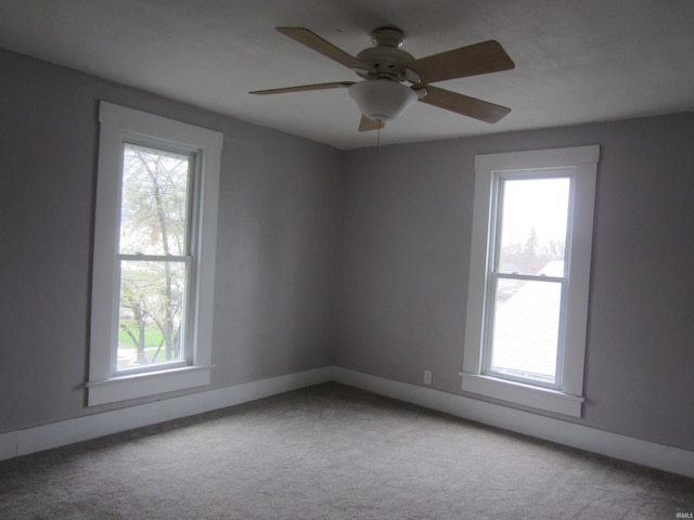 empty room featuring ceiling fan and carpet floors