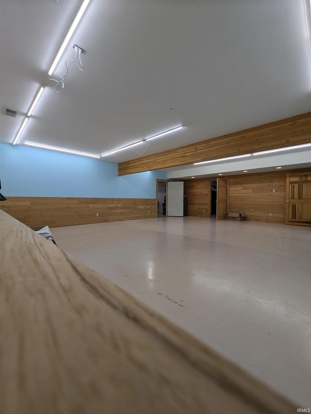 interior space featuring wood walls