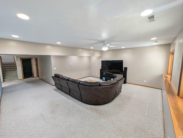 living room with ceiling fan and carpet floors