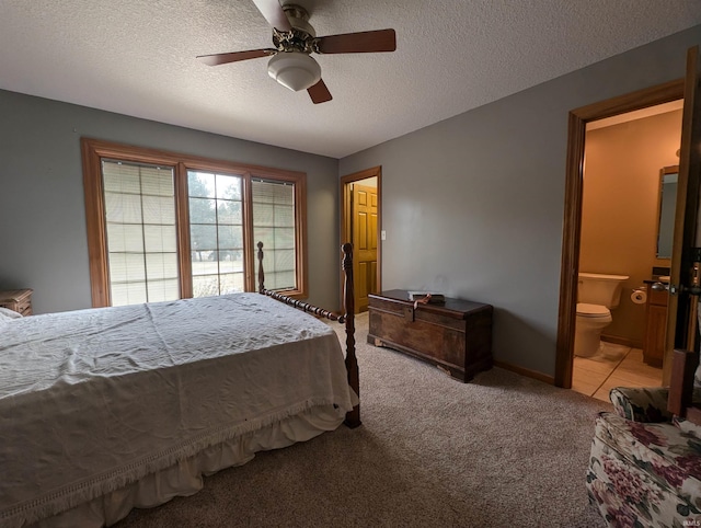 carpeted bedroom featuring ceiling fan, a textured ceiling, and connected bathroom