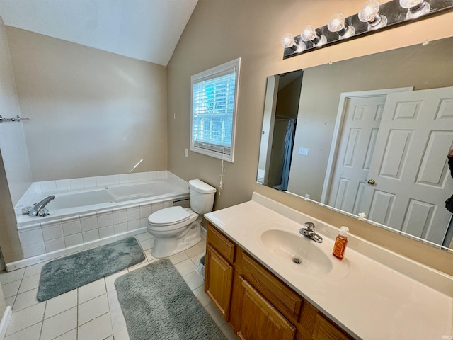 bathroom featuring tiled bath, vanity, lofted ceiling, toilet, and tile patterned floors