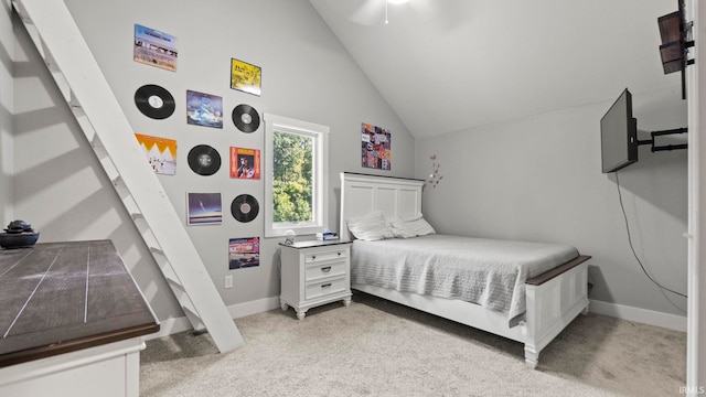 carpeted bedroom featuring vaulted ceiling