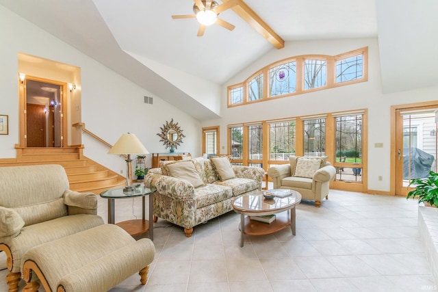 tiled living room featuring beam ceiling, ceiling fan, and high vaulted ceiling