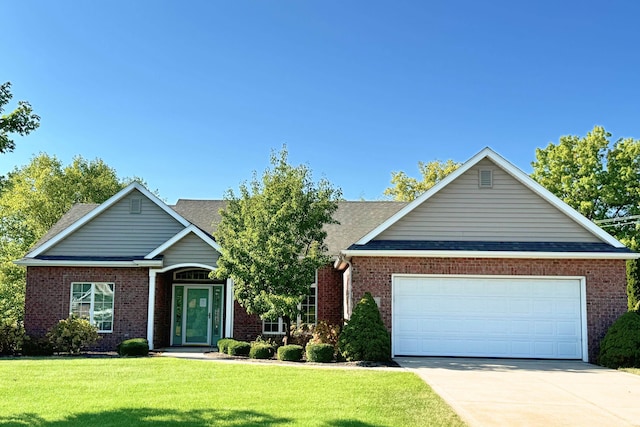 view of front of house with a garage and a front yard