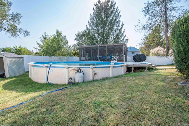 view of swimming pool with a storage shed and a yard