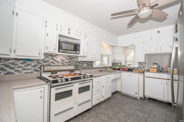 kitchen featuring ceiling fan, white appliances, sink, and white cabinets