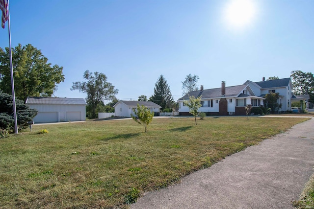 single story home featuring a garage and a front lawn