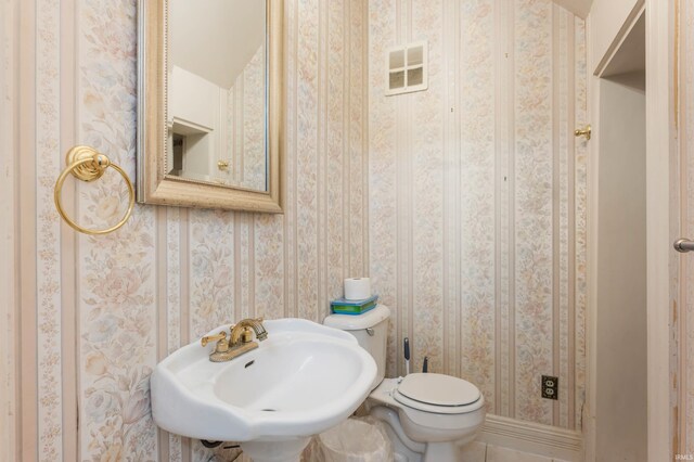 bathroom with sink and toilet