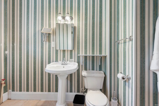 bathroom with tile patterned flooring and toilet