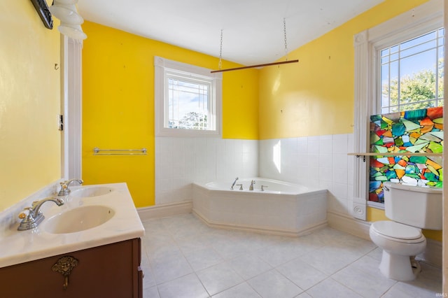 bathroom featuring a bath, tile patterned flooring, vanity, and toilet