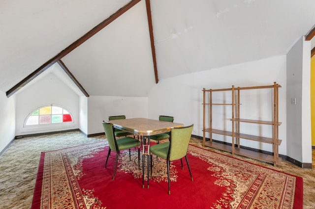 dining area with vaulted ceiling with beams and carpet flooring