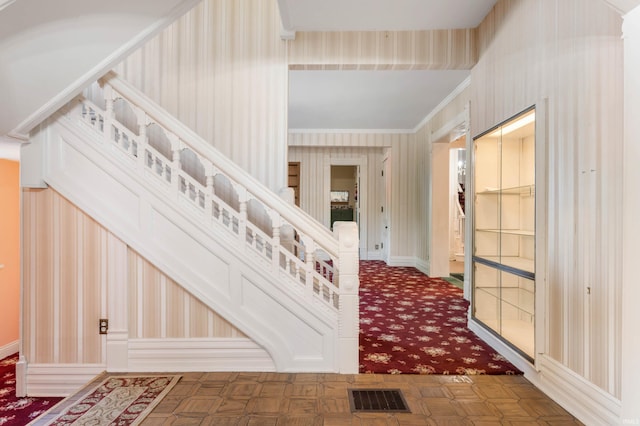 interior space featuring crown molding