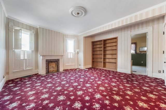 unfurnished living room with a fireplace and crown molding